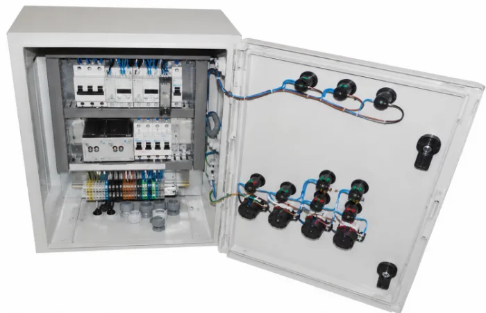 Control panel interior: circuit breakers, residual current protection, rail terminal blocks and door-mounted control devices