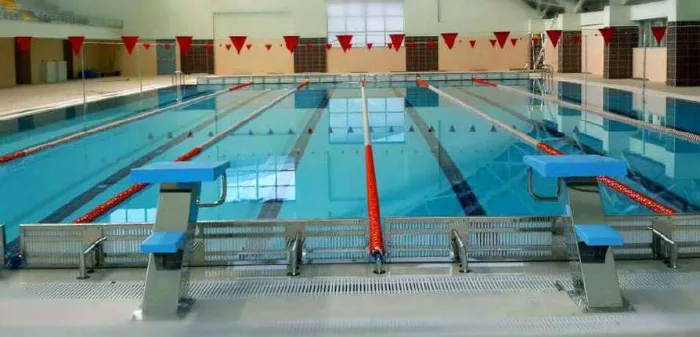 Indoor competition pool fitted with lane separators and starting platforms